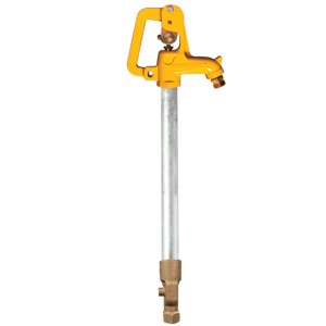 Manual shut-off valve with a yellow handle on a vertical steel pipe, brass connection at the bottom.